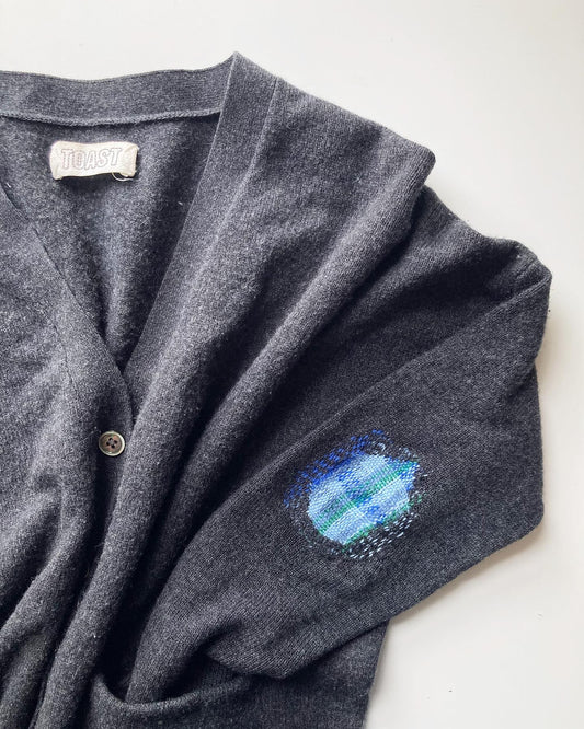 visible mending darned patch on a toast cardigan by slow stitch club
