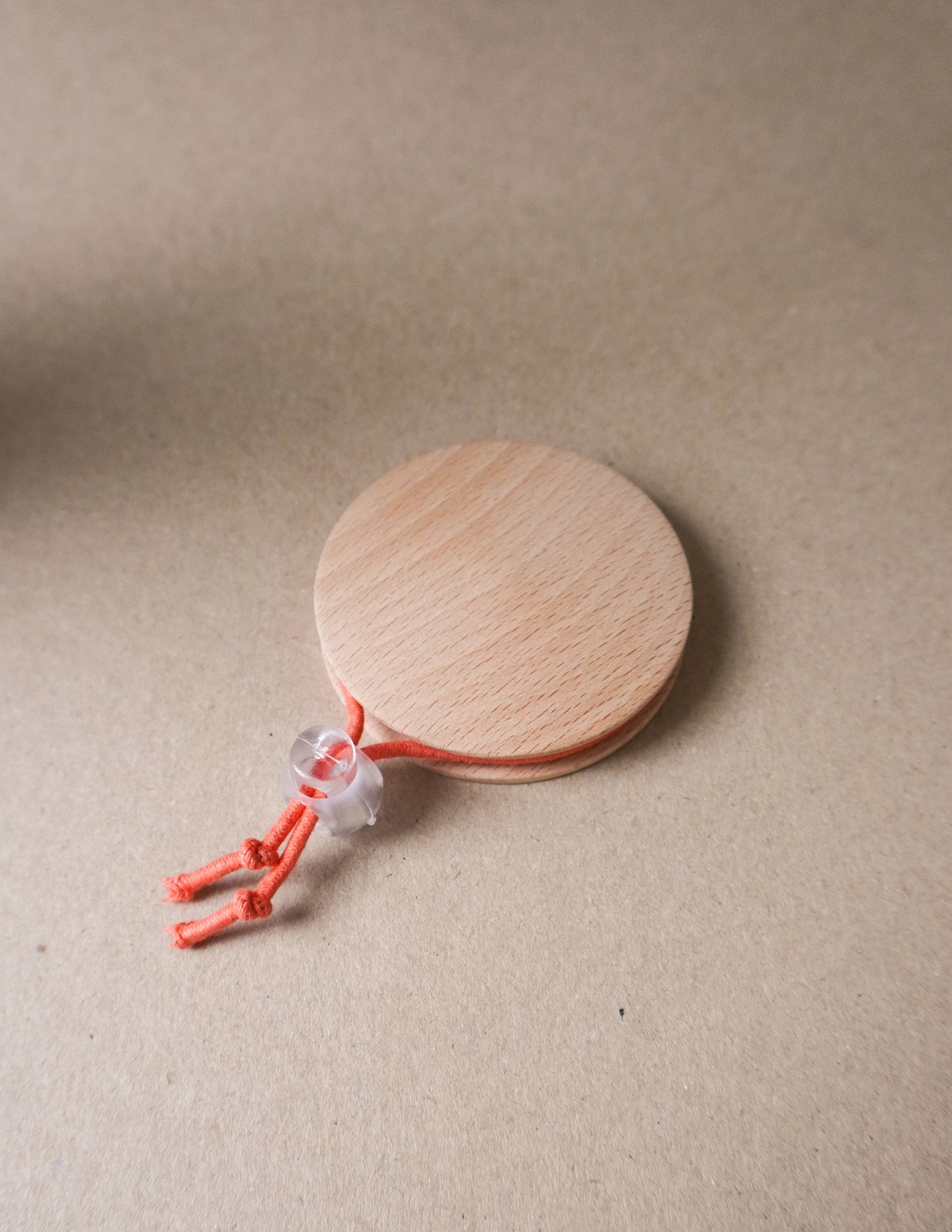 handmade wooden darning disc with elastic tie for visible mending and darning