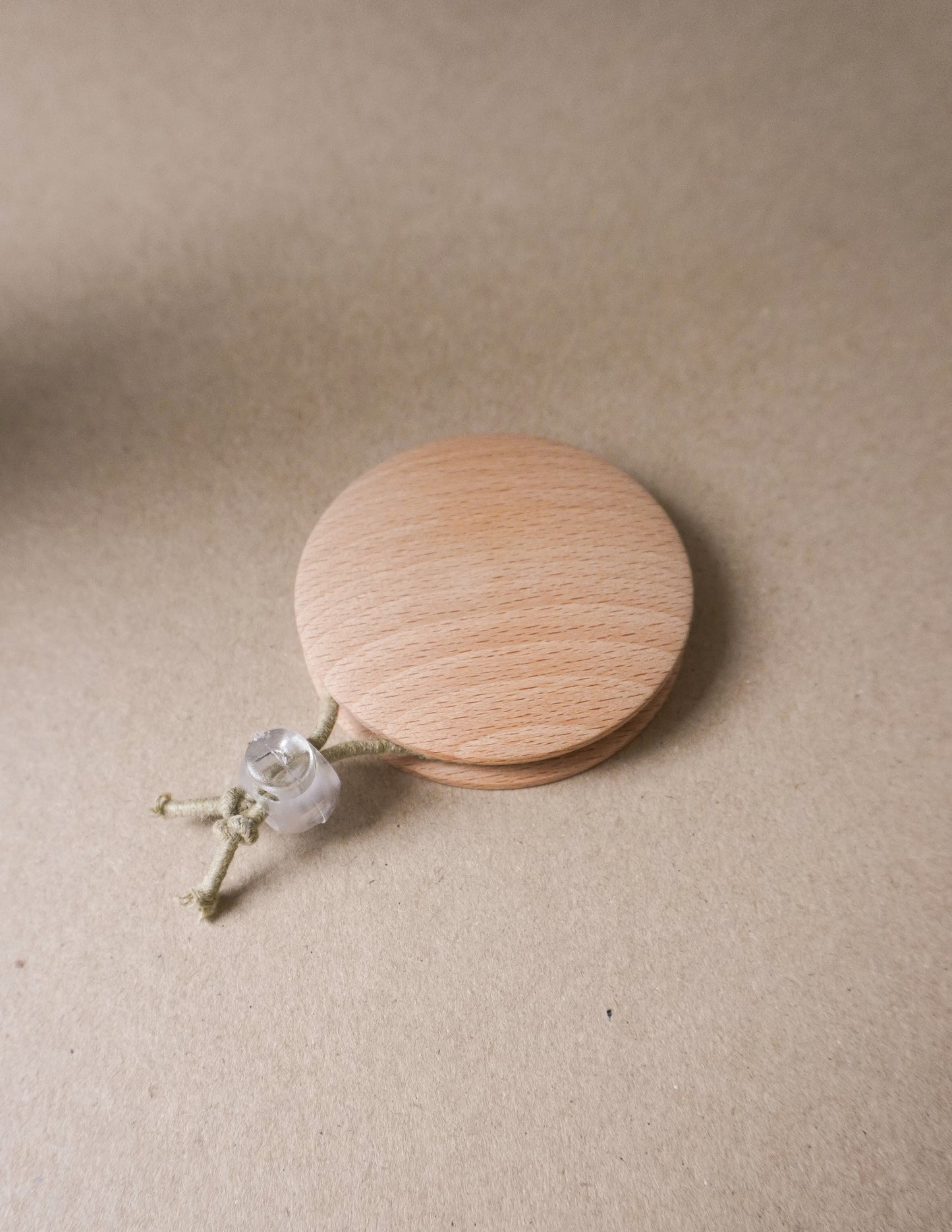 handmade wooden darning disc with elastic tie for visible mending and darning