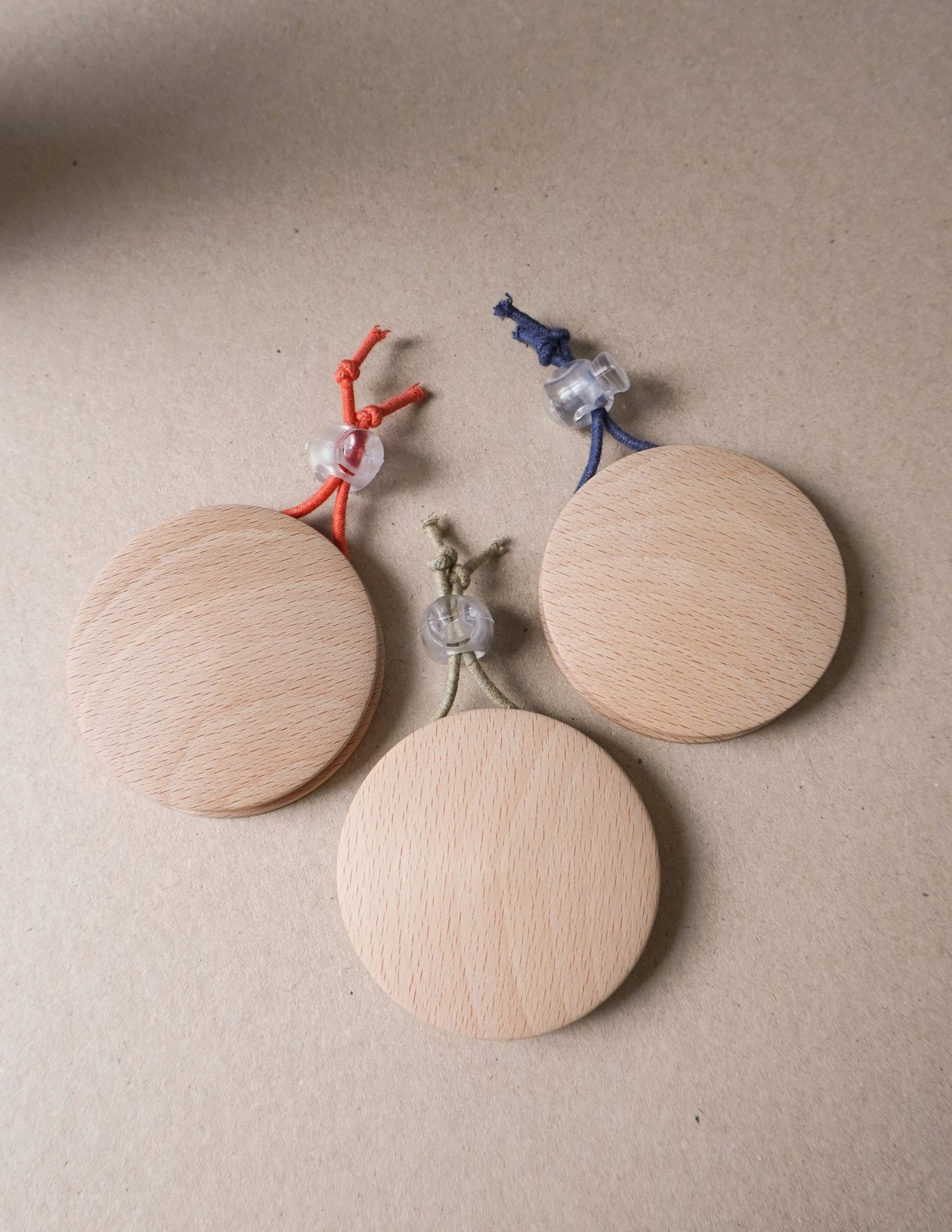 handmade wooden darning disc with elastic tie for visible mending and darning