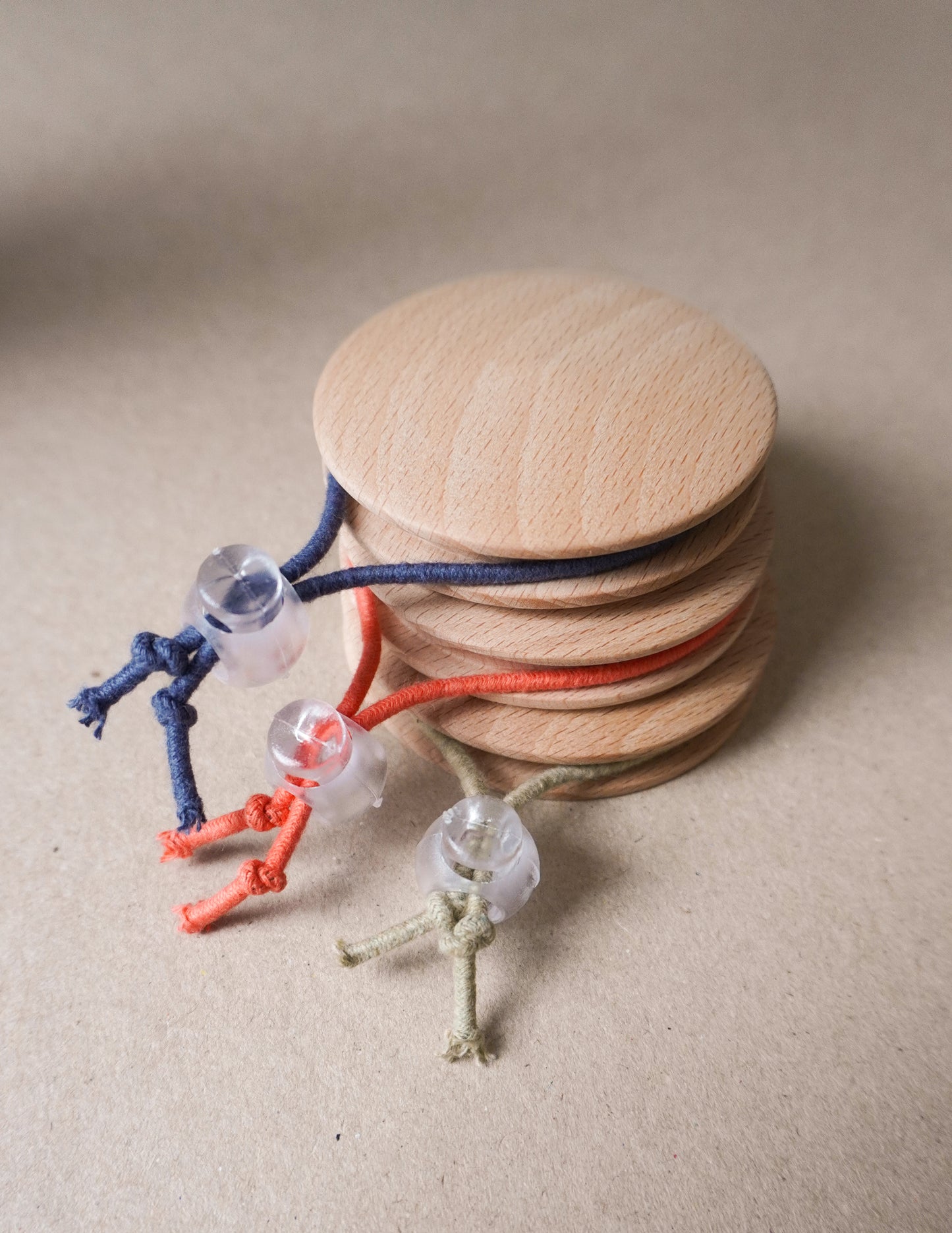 handmade wooden darning disc with elastic tie for visible mending and darning