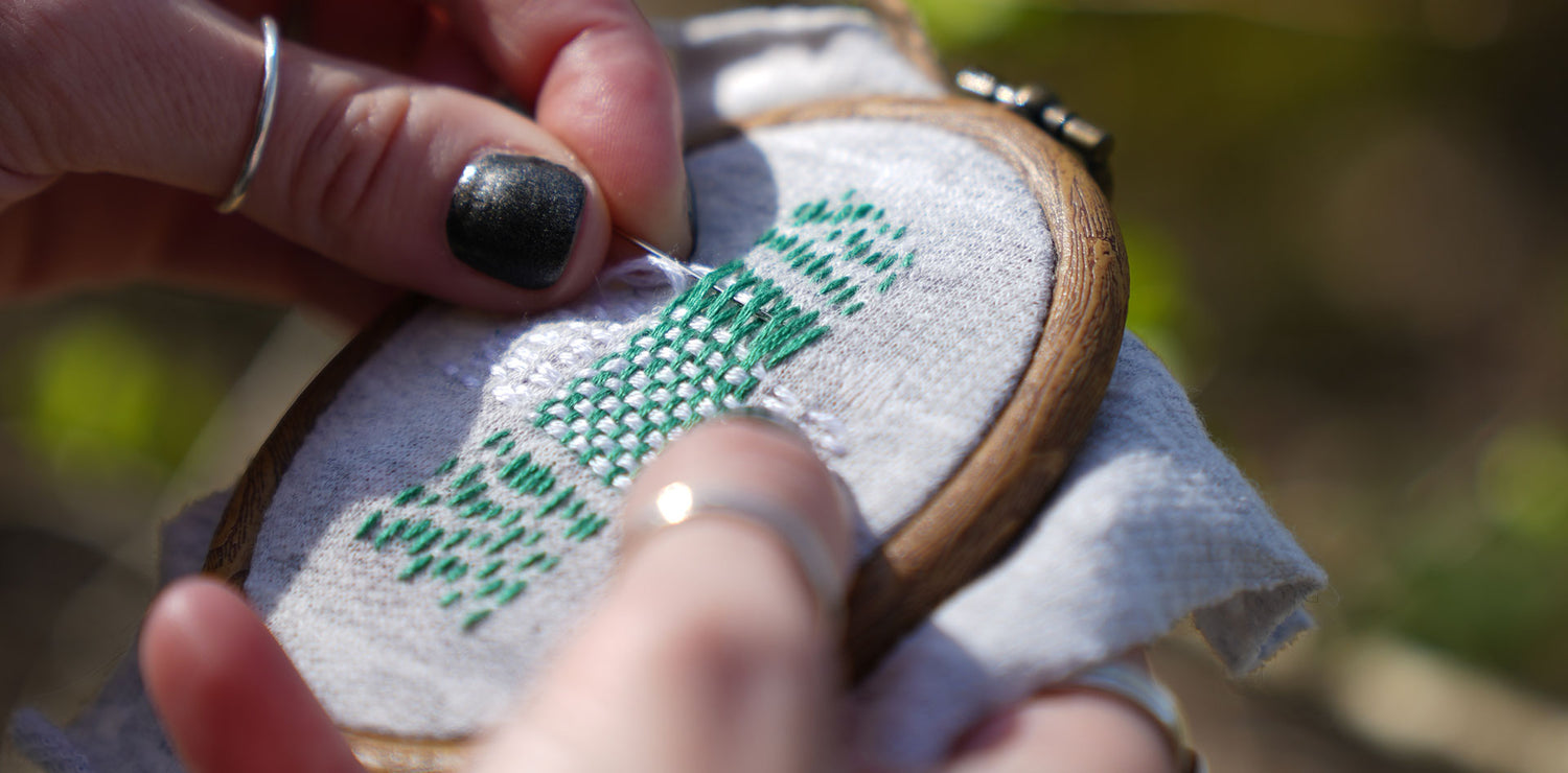 close up of a visible mending darned patch