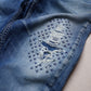 sashiko crosses to repair denim jeans visible mending